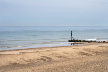 View of Happisburgh beach with sea defenses, North Norfolk, England
