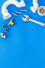 Plumber work with instruments, tools and gear on blue background top view mock up