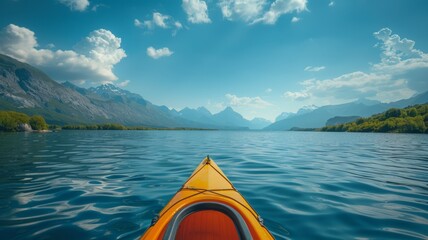 A kayak and paddle on a serene lake with mountains in the distance - obrazy, fototapety, plakaty
