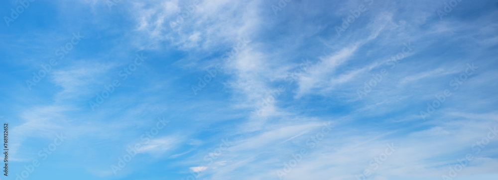 Wall mural beautiful sky panorama with light feathery cirrus clouds in the atmosphere