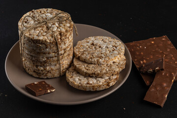 Crunchy rice cakes on dark background. Healthy lifestyle concept.
