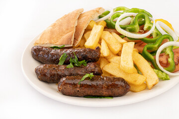 grilled sausages with french fries and salad