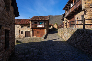 Fototapeta na wymiar Beautiful village of Barcena Mayor with the traditional stone houses in the Cantabria mountains in a sunny day. Cantabria, Spain.