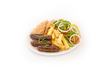 grilled sausages with french fries and salad