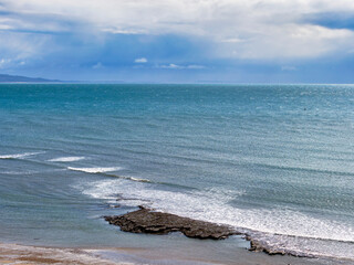 Scenic view of Lyme Bay at Lyme Regis in Dorset under the spring squally weather in March
