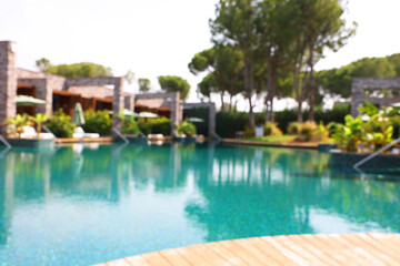 Outdoor swimming pool at resort, blurred view