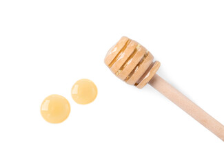 Wooden dipper and fresh honey on white background, top view