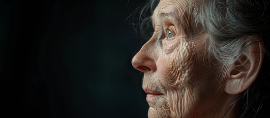 A dignified elderly woman's profile view, her gaze reflecting wisdom and grace.