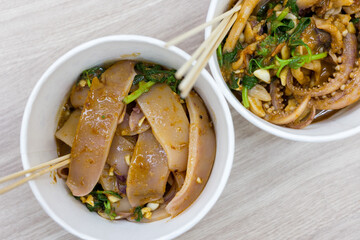 Chili satay sauce squid in the night market