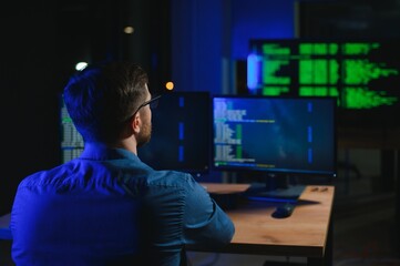 programmer working at desk in office