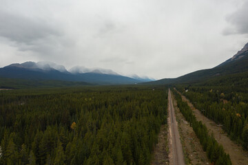 Train tracks crossing the rocky mountains of Canada