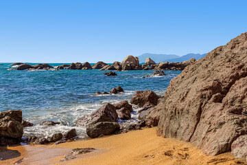 View of the rocky shore of the South China Sea in the World's End Park. Sanya, China