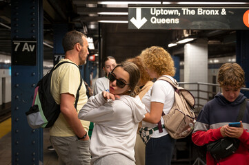 Family Navigating Through NYC Subway Station