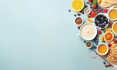 Top view of Healthy breakfast concept with fresh pancakes, berries, fruit on blue backgroudt. Free space for your text.