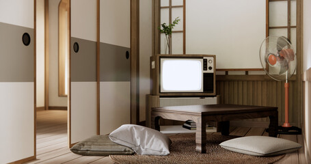 TV on canbinet low table in room Japanese style with lamp.