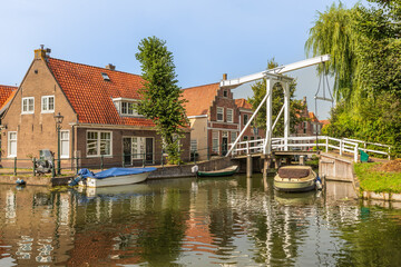 Fototapeta na wymiar Canal houses and drawbridge in the center of Monnickendam.