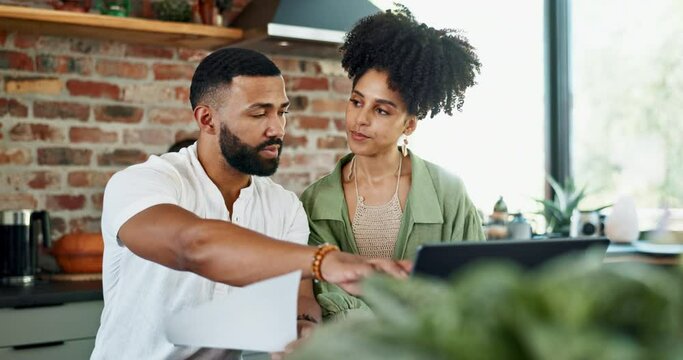 Black couple, home and laptop with documents for budget planning, bills and checklist for expenses. Kitchen, relationship and paperwork with household cost, invoice and discuss receipt for savings