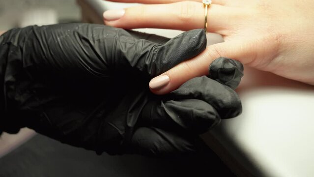 Nail acrylic paint applied onto nail, by nail technician
