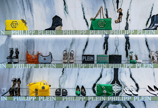 SPAIN, MARBELLA, MAY, 23, 2024: Modern interior of Philipp Plein boutique with a new collection of sports shoes and bags in Marbella. Spain. Philipp Plein is a German fashion designer