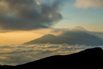 Scenic view of clouds and mist at sunrise