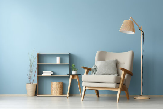 A living room with a blue wall and a wooden chair with a white pillow. The chair is next to a wooden shelf with a basket on it. A potted plant is on the floor