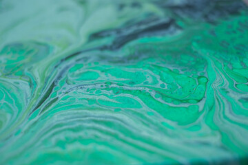 Beautiful fluid art natural luxury painting. Marbleized effect. Ancient oriental drawing technique. Teal, green, blue and turquoise colors. Abstract decorative marble texture. 