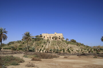 Saddam palace on hill in Babylon with blue sky