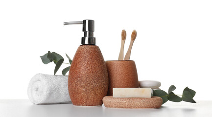Bath accessories. Different personal care products and eucalyptus branches on table against white background