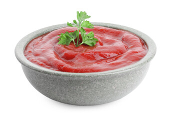 Tasty ketchup with parsley in bowl isolated on white. Tomato sauce