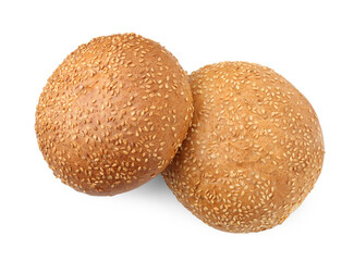 Fresh hamburger buns with sesame seeds isolated on white, top view