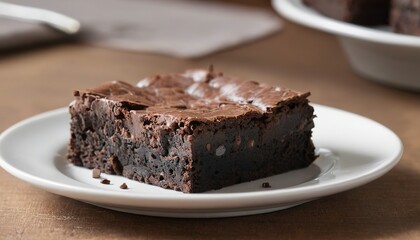 slice of homemade brownie on plate on table