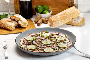 Carpaccio de pulpo, limon, Italia