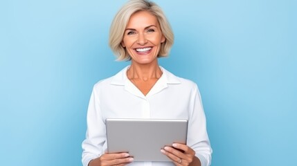 Mature female experienced doctor, healthcare professional, dentist, stomatologist, nurse smiling on a blue background