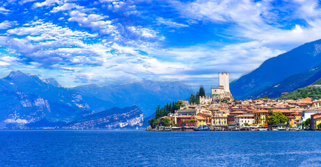 Northern italian lakes scenery - beautiful Lago di Garda. panoramic view of Malcesine castle and village - 768980483