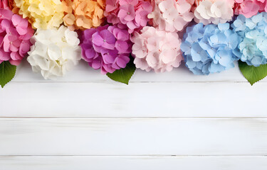 colorful hydrangea flowers on white wooden table for greeting ho