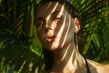 beautiful girl. young sexy woman in bikini under palm tree - 768987251