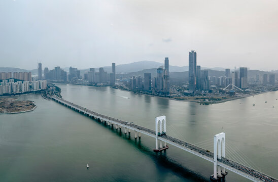 Macao, March 15th 2023 : Aerial View of Sai Van Bridge, a bridge connecting Old City Macao with New Macao area of Taipa and Cotai. Also seen is the new development area of high rise buildings, condo