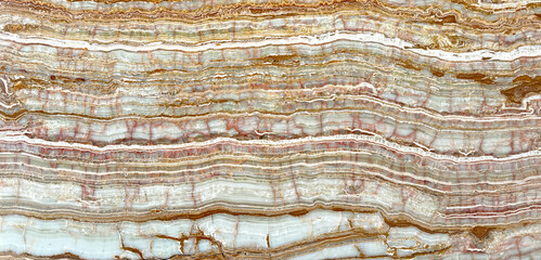 Natural dessert Onyx vein cut in beige and orange colors. Also called rainbow Onyx veining....