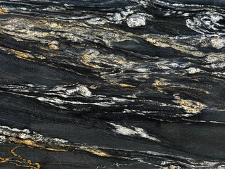 Exotic Nero Volcano marble seamless texture. Or Belvedere Granite natural slab tiles in Black, white, and golden yellow vein color. Seamless texture.