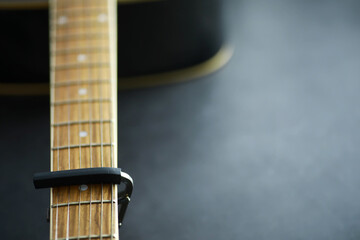 An acoustic guitar for an artist playing a stringed musical instrument on stage. Black guitar with...
