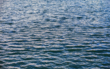 Water surface. The texture of the water. Waves on the lake in windy weather.