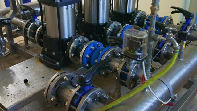 Modern water pumps in a water plant station, Sewage pumping stations, stormwater, utilities. High quality 4k footage