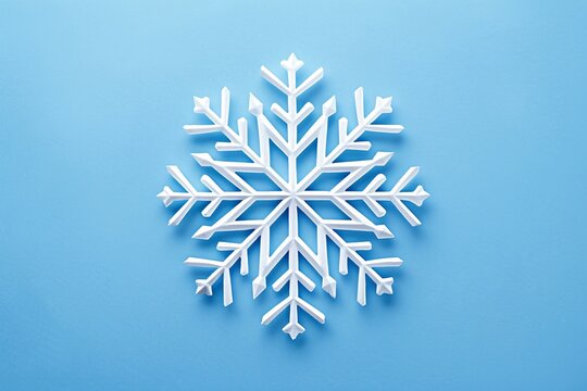 a white snowflake on a blue background