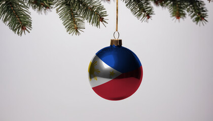 New Year's ball with the flag of Philippines on a Christmas tree branch isolated on white background. Christmas and New Year concept.