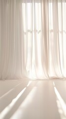 an empty room with backlit window and delicate beige-pink translucent curtains
