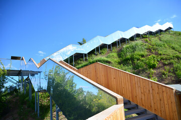 stair with mirror wall going up with blue sky on background copy space 