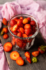 Ripe strawberry and blueberries in glass on the rustic background. Selective focus. Shallow depth of field.