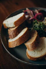 The photo shows food from the restaurant, namely bread, cheese and cold cuts