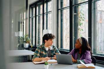 College student communicating while studying in the classroom.