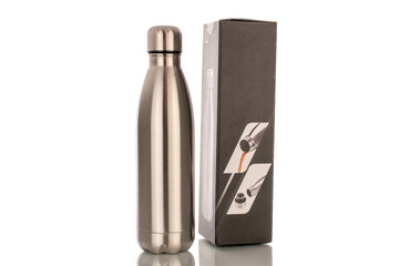 One metal thermos bottle with paper box, macro, isolated on white background.